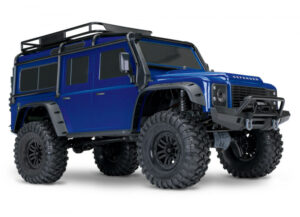 v02_486AFFC82CD3A997F807FC2C1F81335C-1.jpg LAND ROVER DEFENDER SCALE & TRAIL 4WD BLÅ - TRAXXAS